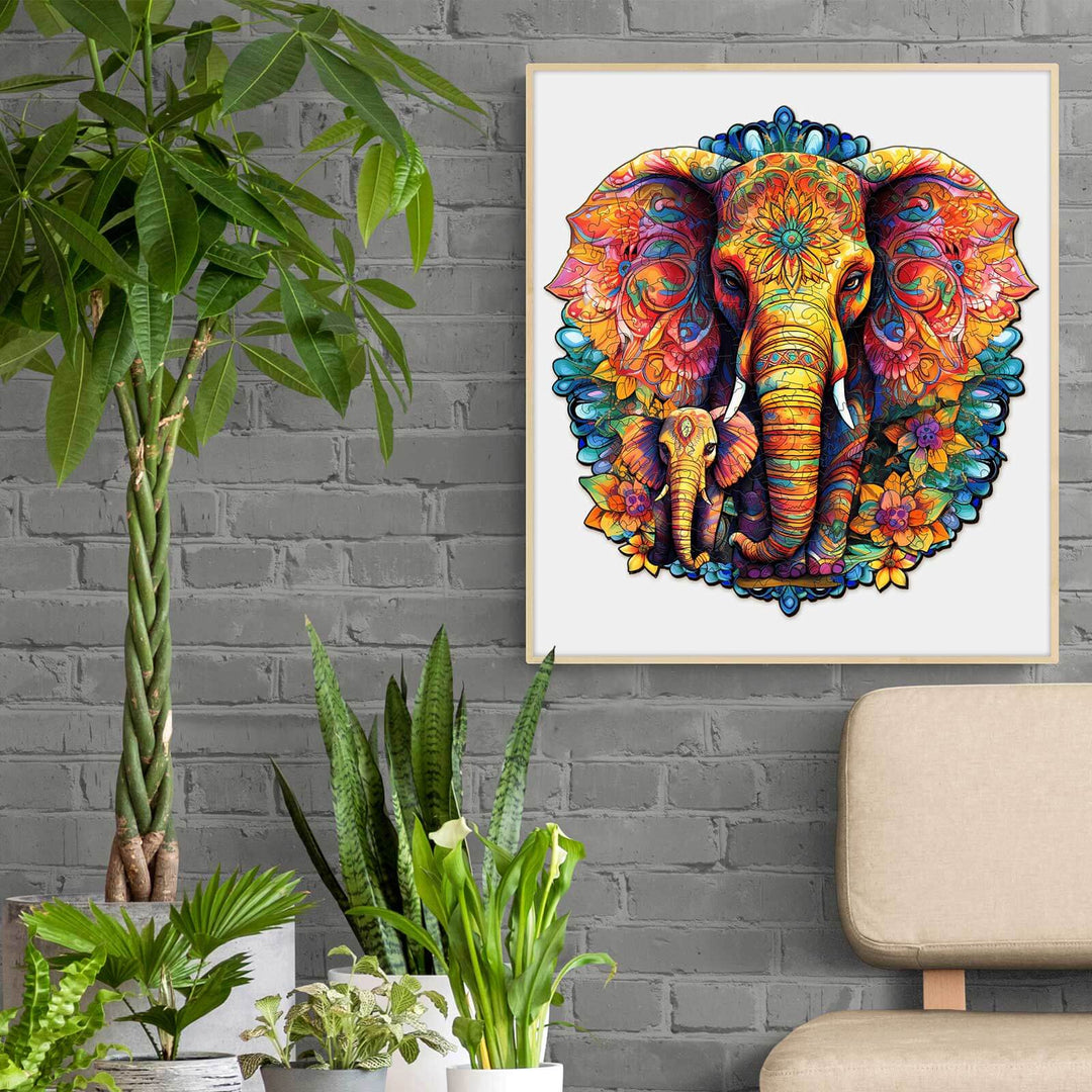 Colorful mandala elephant and baby artwork displayed in a modern living room with plants.
