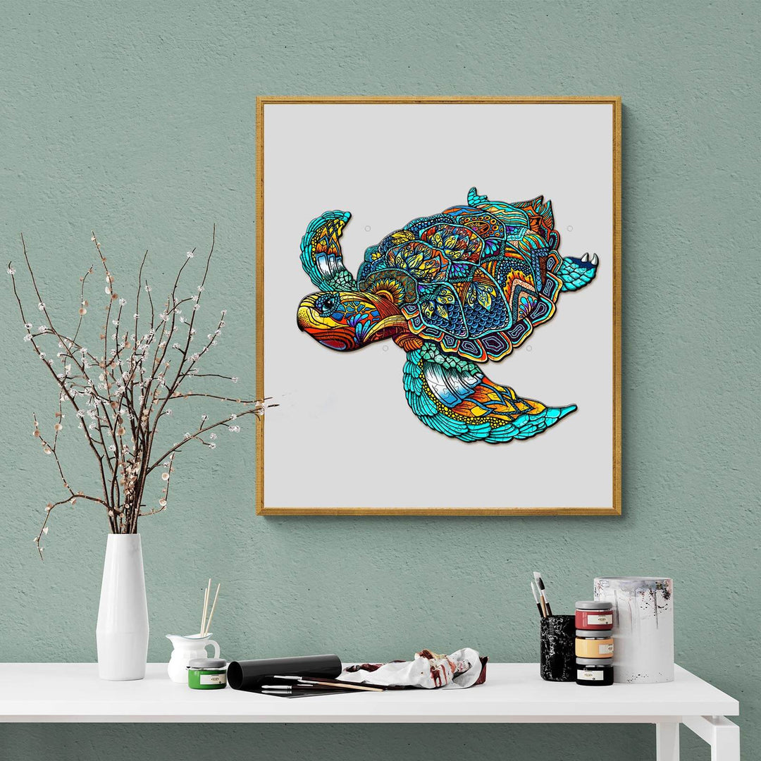 Vibrant turtle artwork in a wooden frame, showcasing intricate patterns and colorful designs on a green wall backdrop.