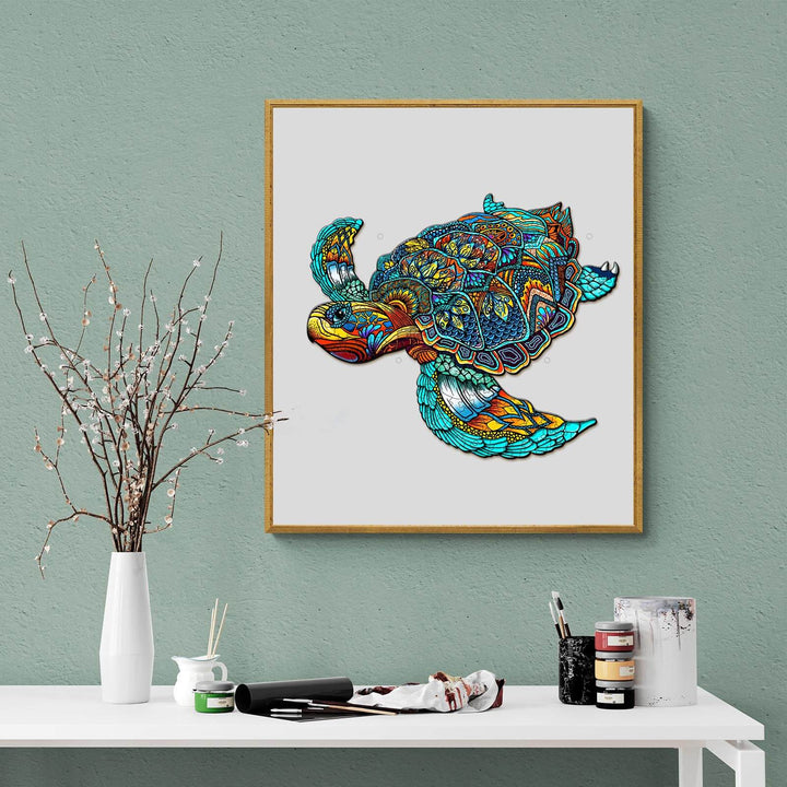Vibrant turtle artwork in a wooden frame, showcasing intricate patterns and colorful designs on a green wall backdrop.