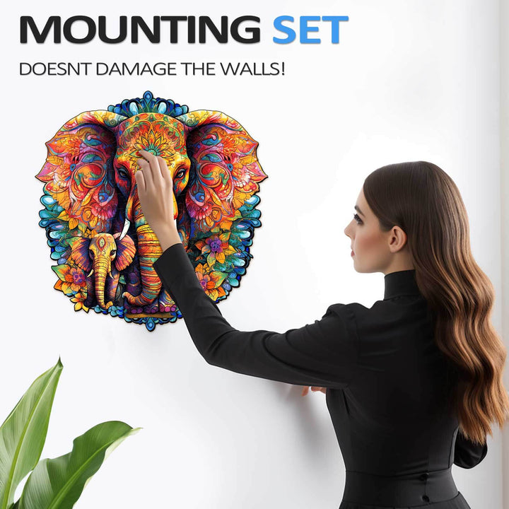 Colorful mandala elephant wall art with a woman using a mounting set, designed not to damage walls.