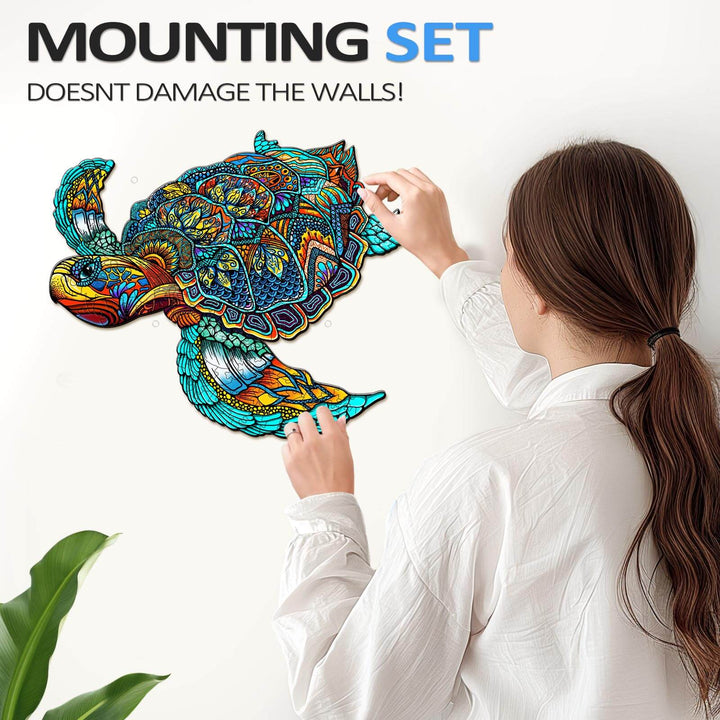 Woman applying vibrant turtle wall art using a mounting set, ensuring walls remain undamaged.