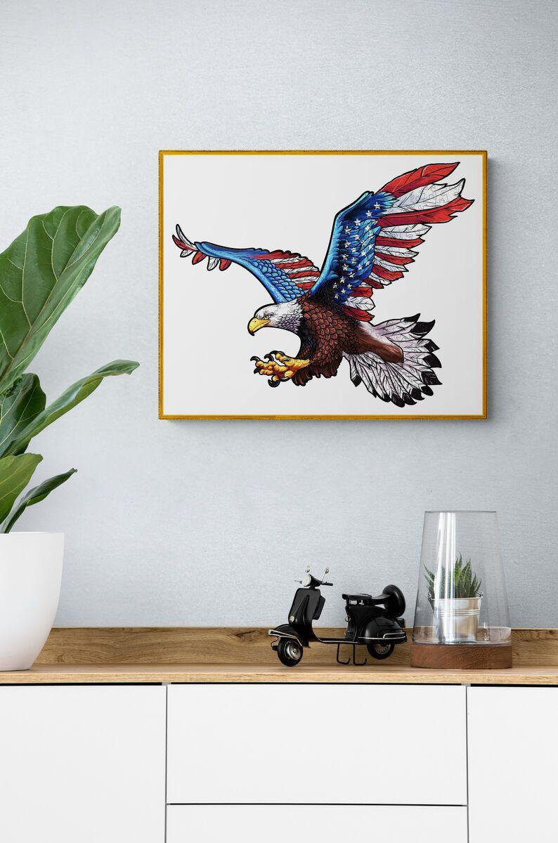 Framed illustration of a soaring eagle with a patriotic color scheme, displayed in a modern interior setting.