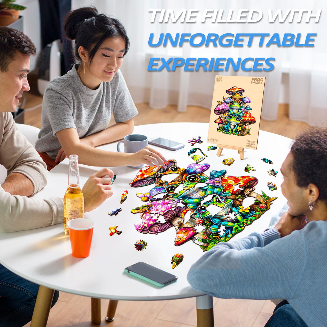 Friends assembling Frog Family wooden jigsaw puzzle on table, showcasing unique colorful pieces and joyful experience.