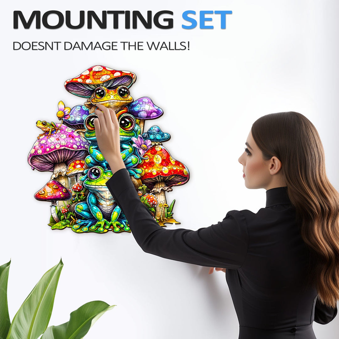 Woman applying a decorative frog and mushroom wall art using a mounting set that doesn't damage walls.