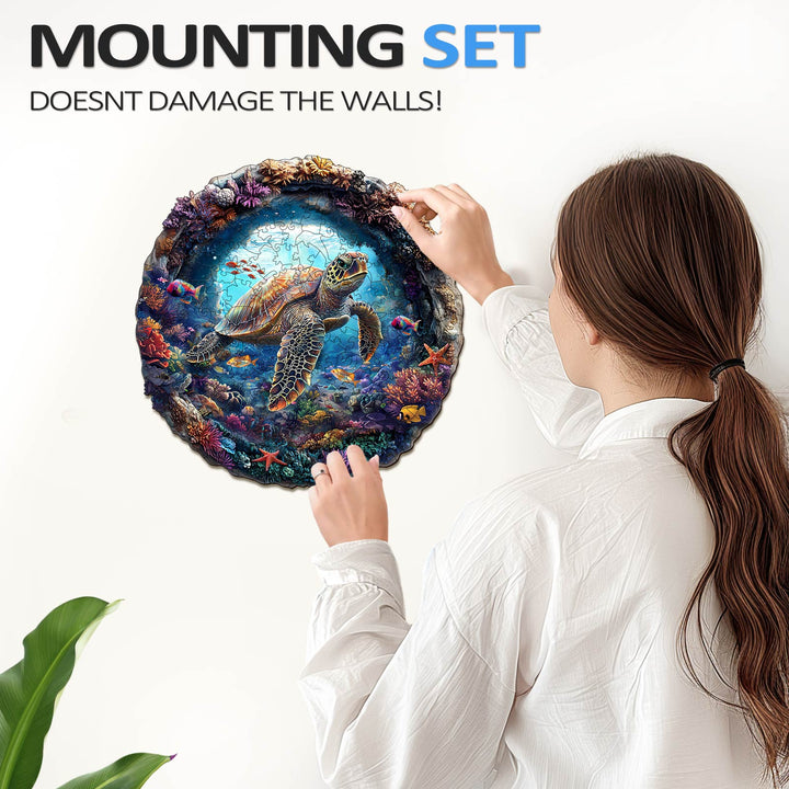 Woman installing a 3D turtle wall art using a mounting set that doesn't damage walls.