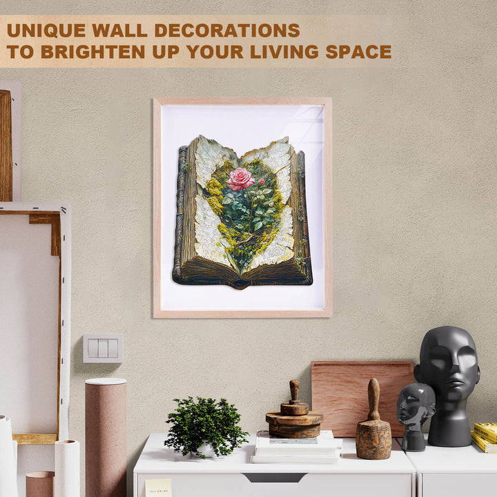 Framed artwork of a botanical design in an open book, enhancing living space decor.
